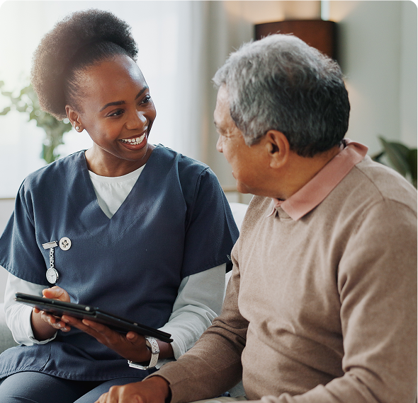 Friendly nurse holding tablet with patient